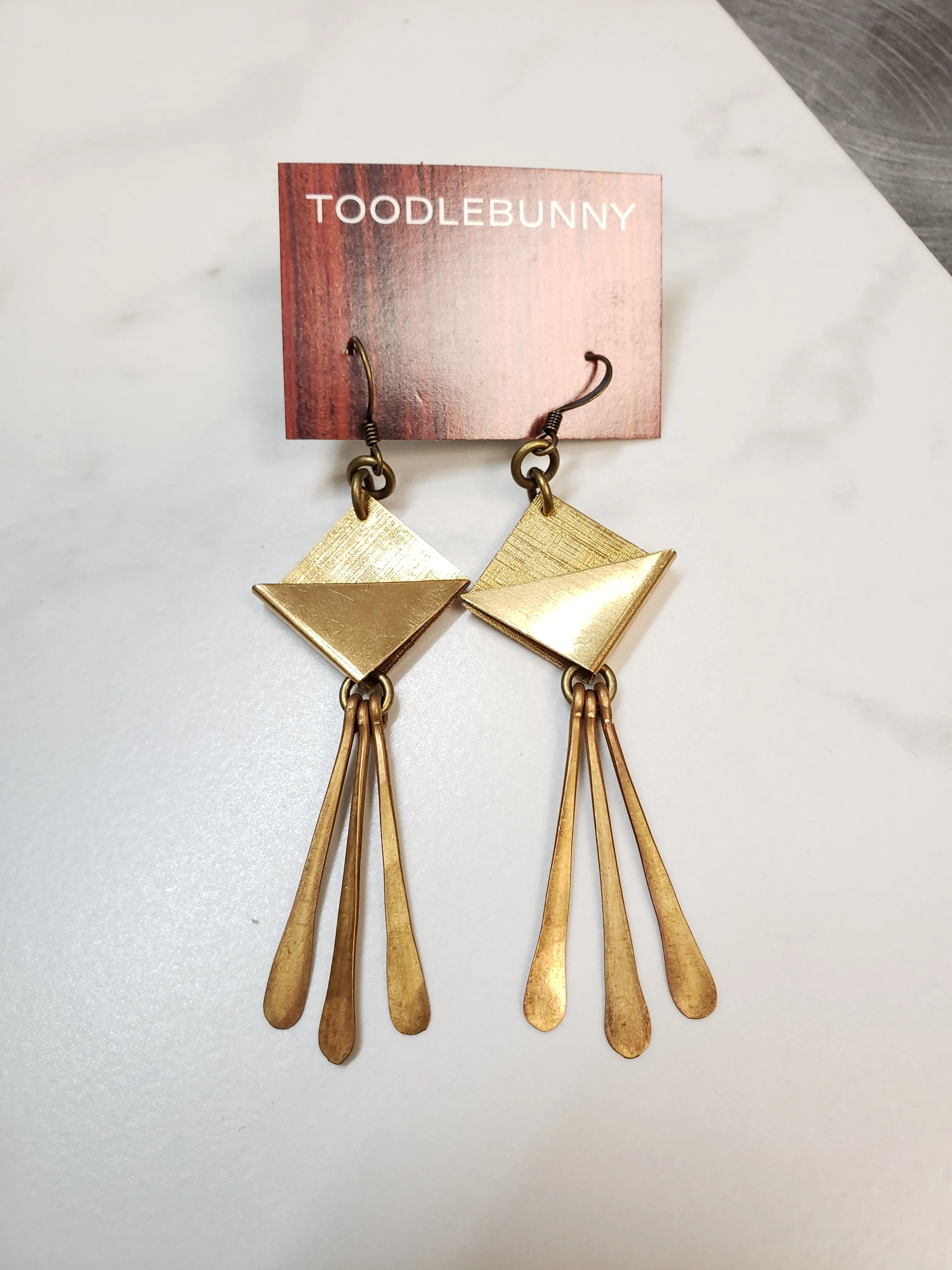 Geometric brass paddle fringe earrings