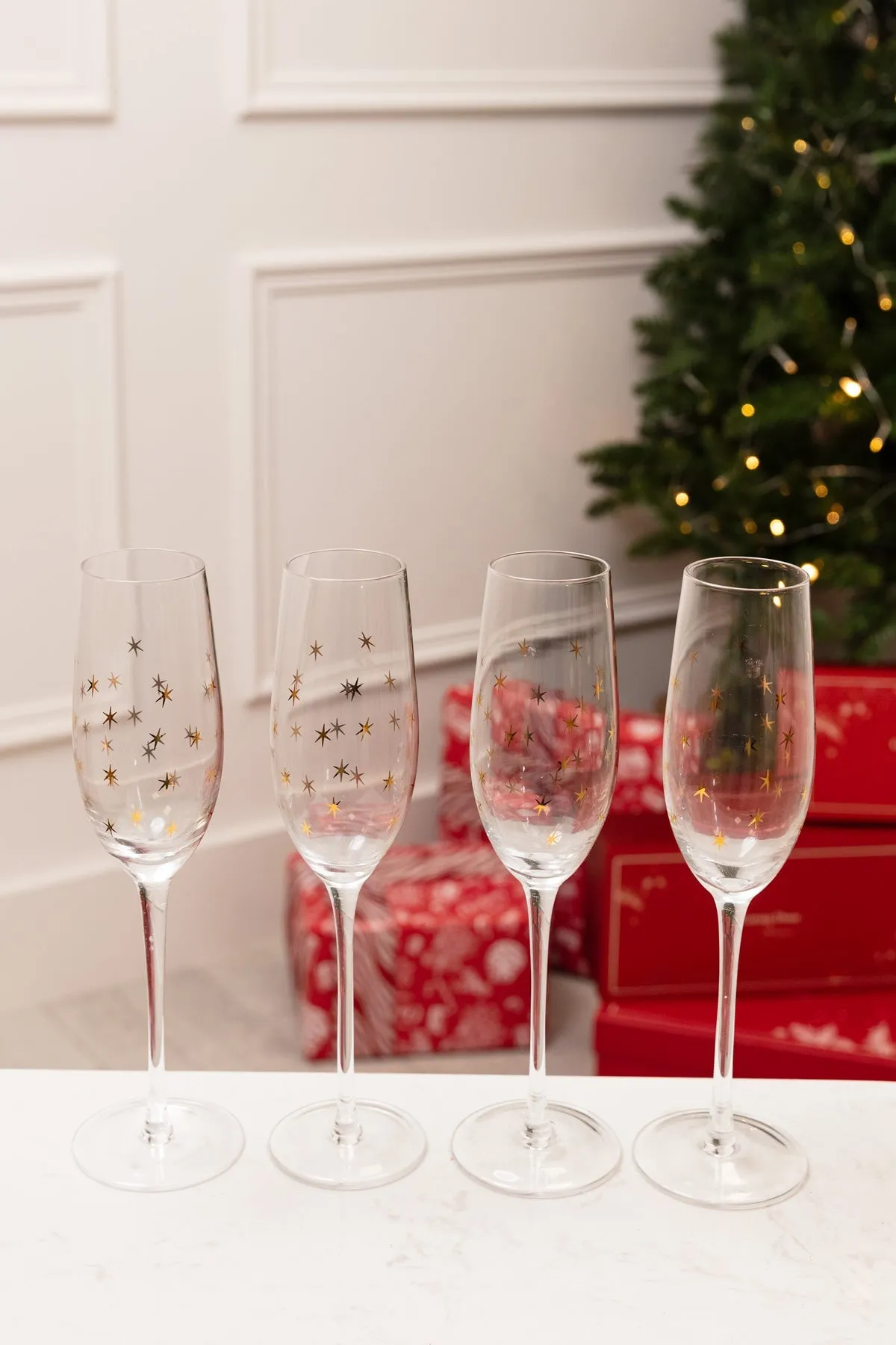 Set Of 4 Gold Star Champagne Glasses